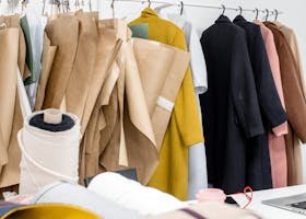 A vibrant display of fabrics and designs in a modern fashion studio.